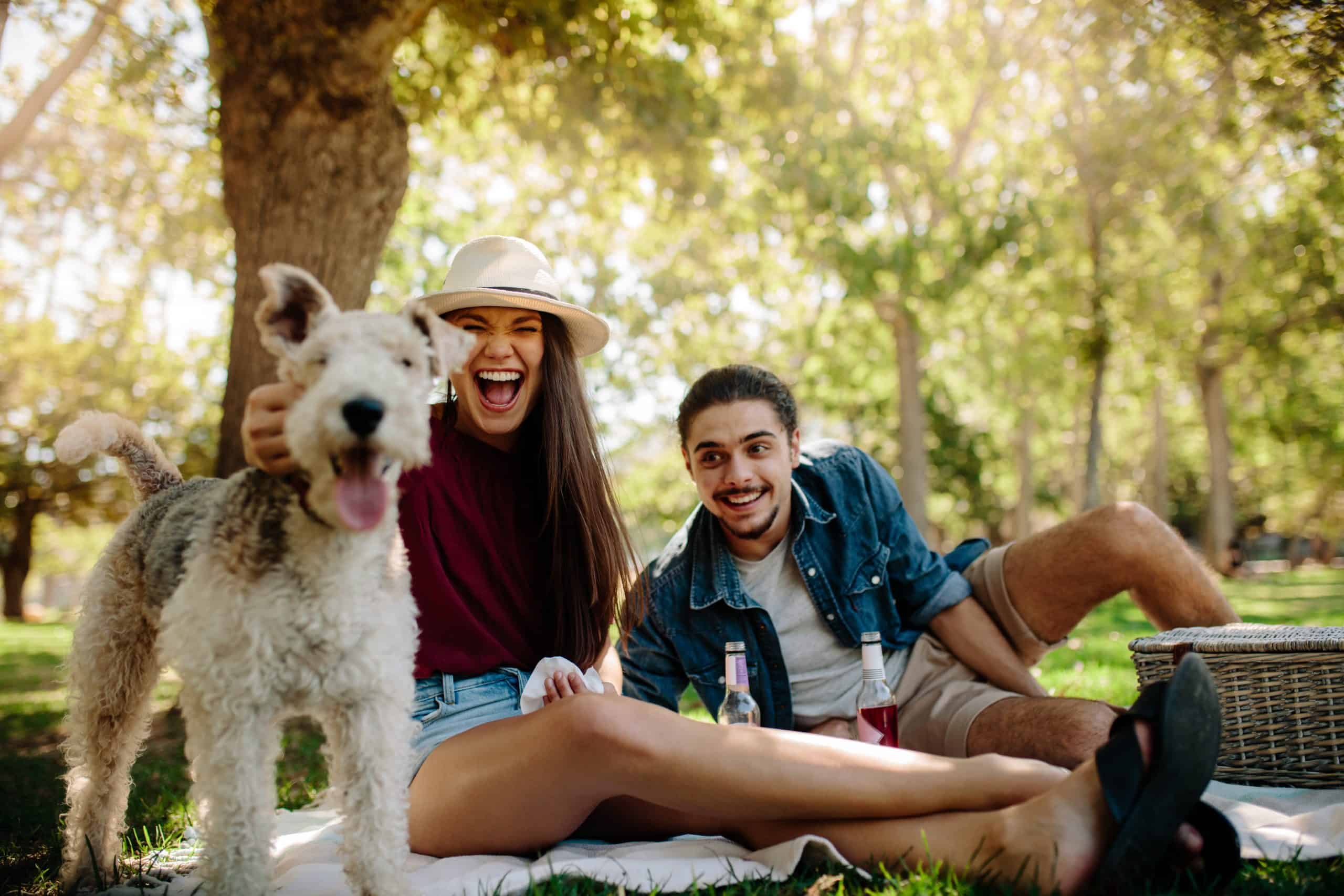 couple with dog at park