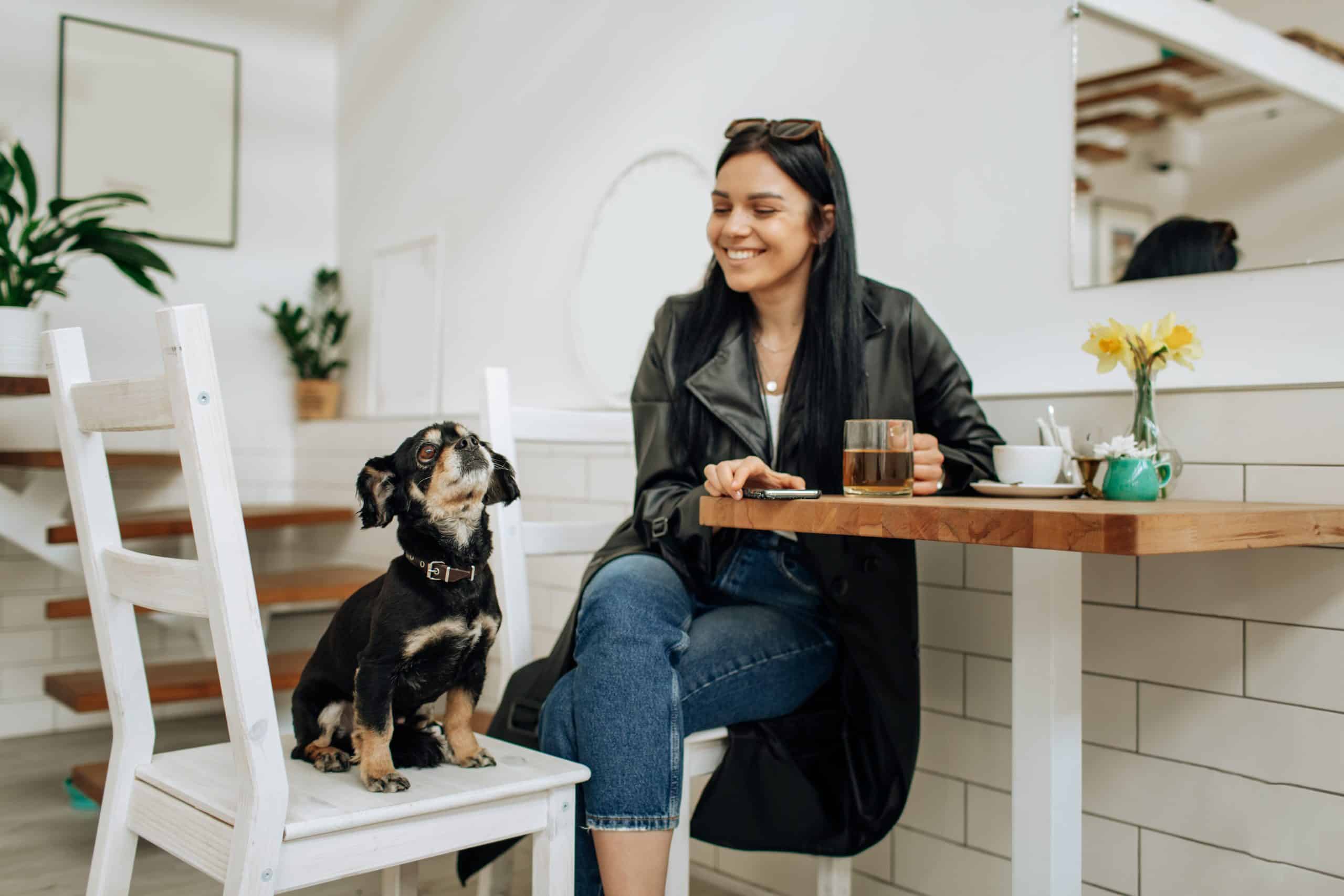 woman at cafe with dog